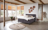 Boxspringbett Bondone – modernes Kopfteil, Webstoff Anthrazit – Milieu-Ansicht ohne Fußteil | Betten Deluxe