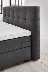 Boxspringbett Renoir – symmetrische Steppung, Samt Graphit – Kopfteil-Nahaufnahme | Betten Deluxe