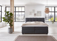 Boxspringbett Renoir – symmetrische Steppung, Samt Graphit – Frontalansicht | Betten Deluxe