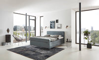 Boxspringbett Pollock – horizontale Steppung, Leinen-Webstoff Natur – Milieu-Ansicht mit Fußteil | Betten Deluxe