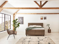 Boxspringbett Picasso – doppelte Steppung, Kunstleder Dunkelbraun – Frontalansicht | Betten Deluxe